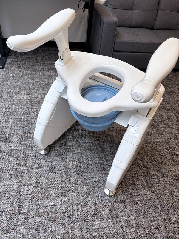 Toilet lift with commode pan