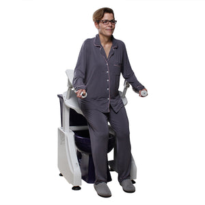 Dignity Lifts deluxe toilet lift shown with a model